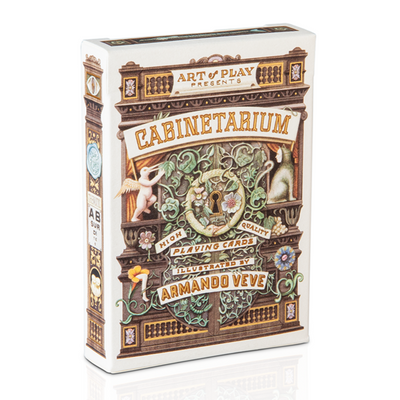 Box cover for Cabinetarium playing cards featuring a richly details drawing of a fanciful cabinet of wonders
